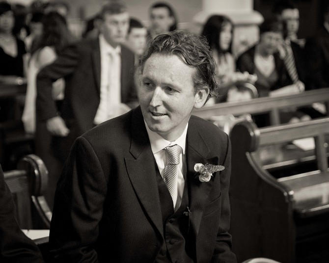 groom waiting for bride at altar